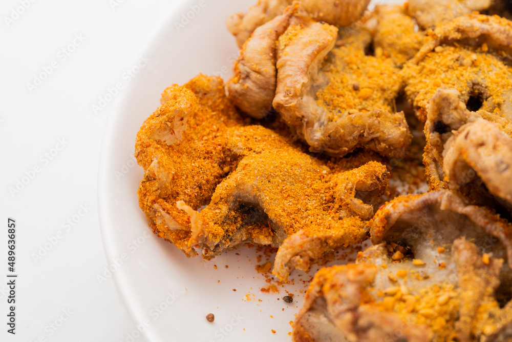 Fresh fried chicken comb oil on white background Fresh fried chicken comb oil on white background
