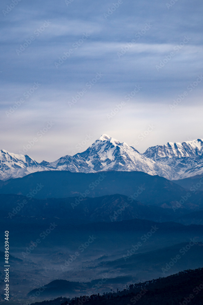 Himalayan Peaks covered in snow, a view from Kausani, switzerland of India.