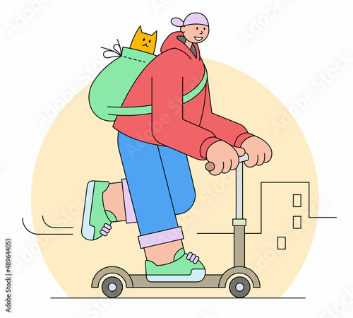 Young man rides on a kick scooter