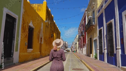 Female Tourist Walking along Streets of Campeche City in Mexico photo