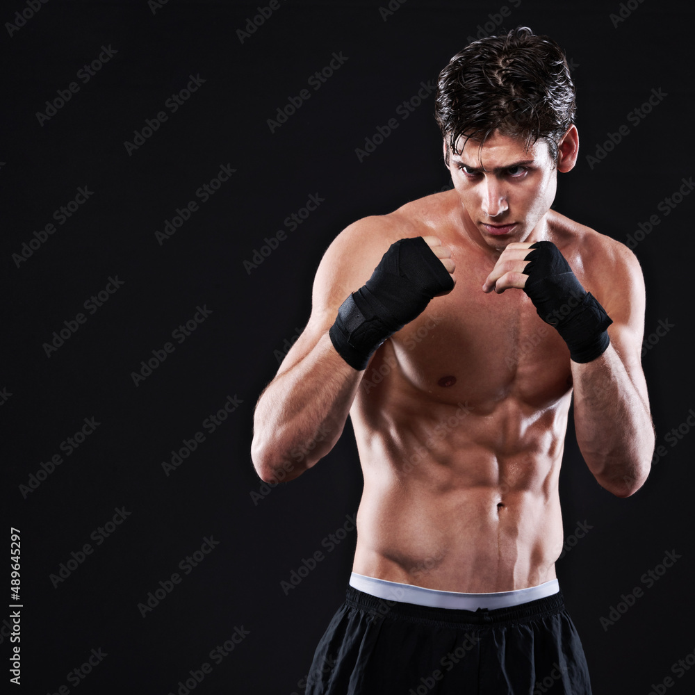 The perfect fighting stance. Studio shot of a young mixed martial artist.