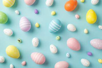 Top view photo of easter decorations multicolored easter eggs on isolated pastel blue background