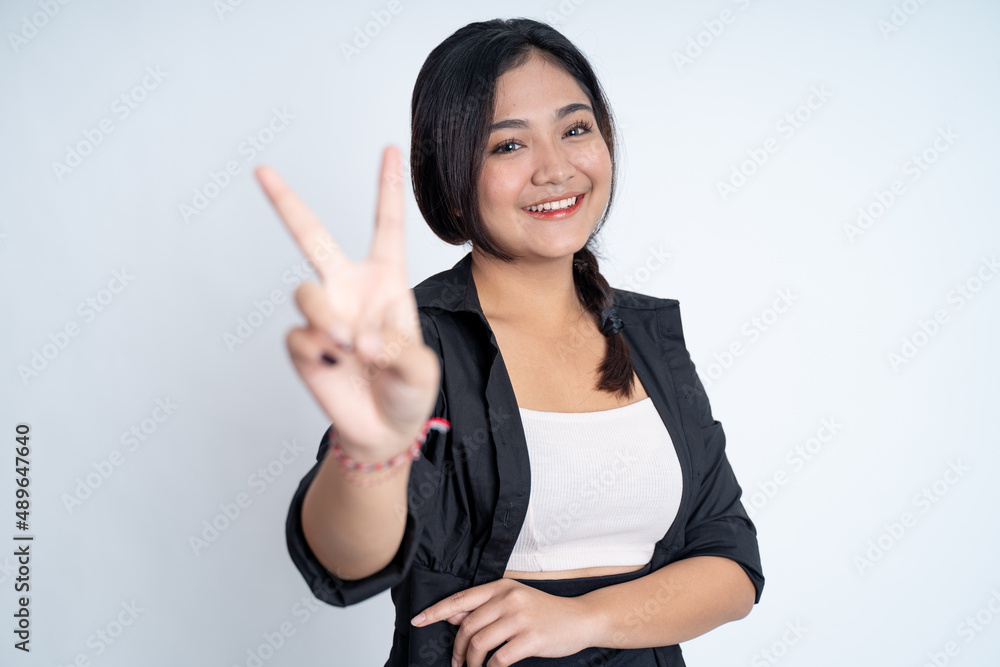 woman with peaceful hand gesture on isolated background woman with peaceful hand gesture on isolated background