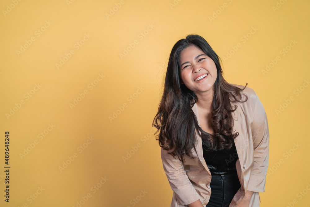excited asian woman with long hair smiling while standing excited asian woman with long hair smiling while standing