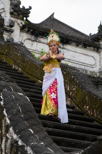 Asia women wearing traditional balinese dance costume in Bali temple. © Ace Mason