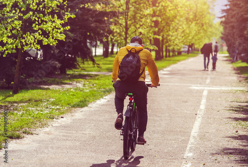 Fototapeta Naklejka Na Ścianę i Meble -  Cyclist ride on the bike path in the city Park
