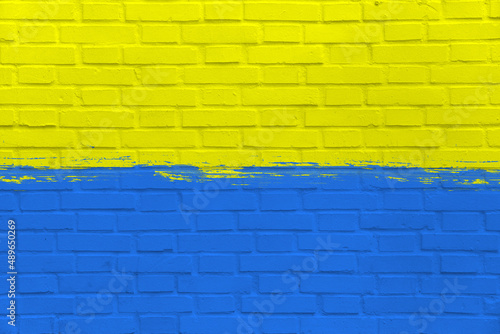 Yellow and Blue Flag of Ukraine on Clean Wall, Industrial Graphic, Symbol of Freedom, Grunge Style Picture, Fight in War with Russia, Symbolic Image, Texture on urban surface, Patriotic background