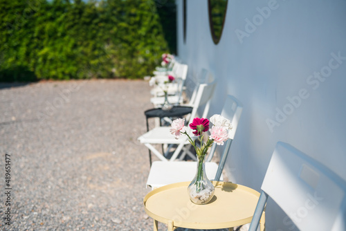Outdoor chairs and flower decor on tables