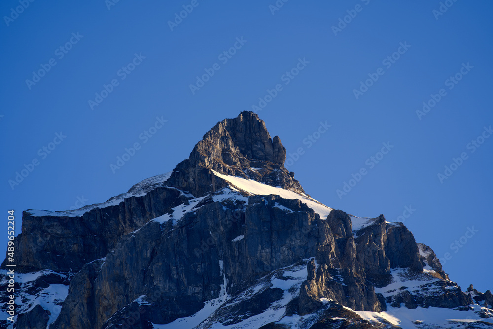 Obraz premium Aerial view of mountain panorama at the Swiss Alps seen from ski resort Engelberg, focus on background. Photo taken February 9th, 2022, Engelberg, Switzerland.