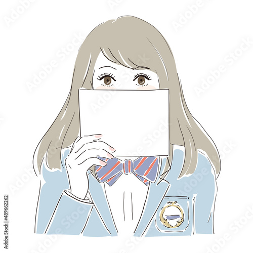 メッセージカードを持ち何かを訴えかける女子高生