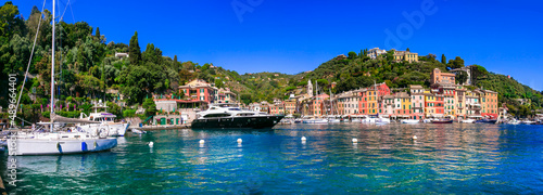 Portofino -Luxury resort and beautiful colorful village in Liguria. Panoramic view with colorful houses and sail boats. Italy travel