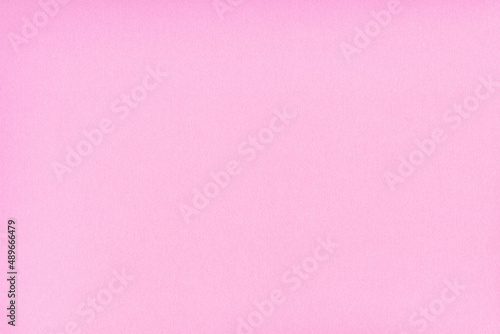 薄いピンクの無地の紙背景