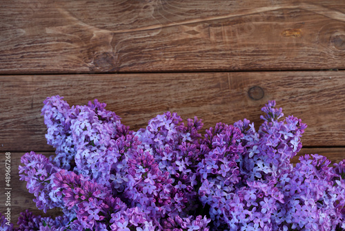 lac flowers in bloom on wooden table. Spring concept. Copy space. Top view. Spring concept