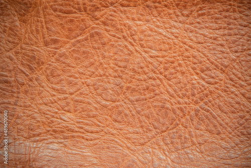 Genuine leather texture background. Dark brown, orange textures for decoration blank. Vintage skin natural suede.