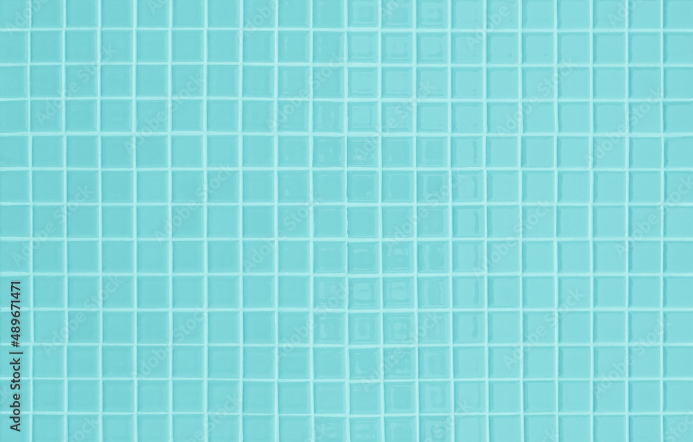 Blue ceramic wall and floor tiles mosaic abstract background. Design geometric wallpaper texture decoration. Blue ceramic wall and floor tiles mosaic abstract background. Design geometric wallpaper texture decoration.