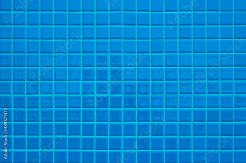 Blue ceramic wall and floor tiles mosaic abstract background. Design geometric wallpaper texture decoration.