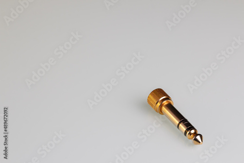 copper audio system adapter on a white background