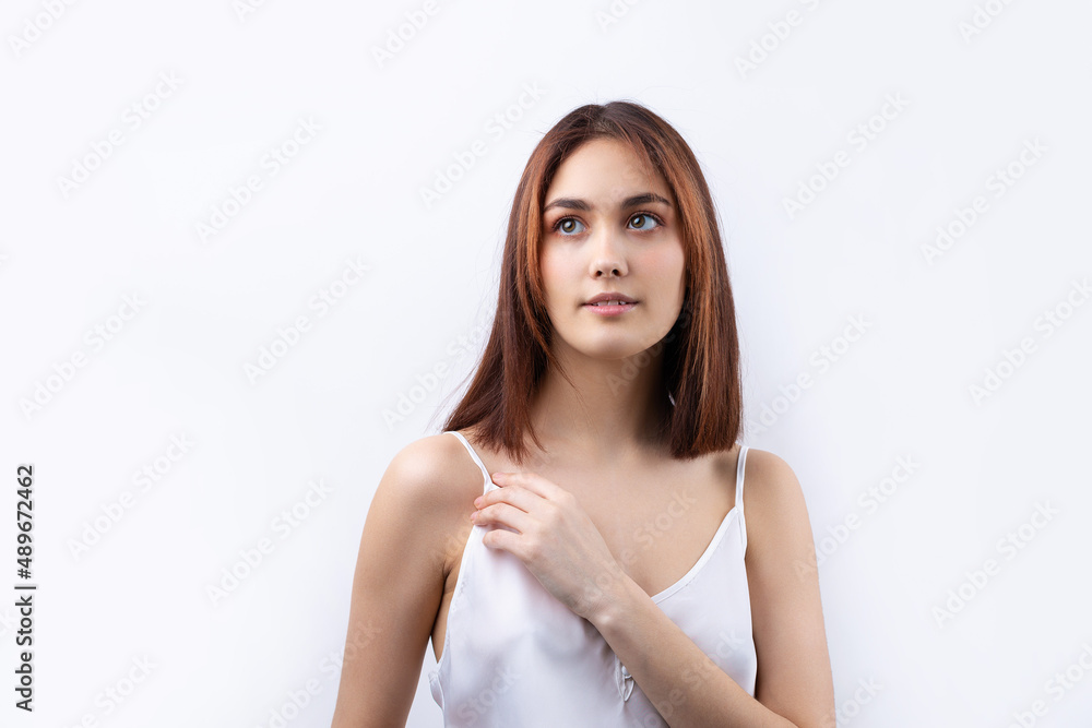 Beautiful smiling woman with clean skin, natural make-up and white teeth on a gray background Beautiful smiling woman with clean skin, natural make-up and white teeth on a gray background