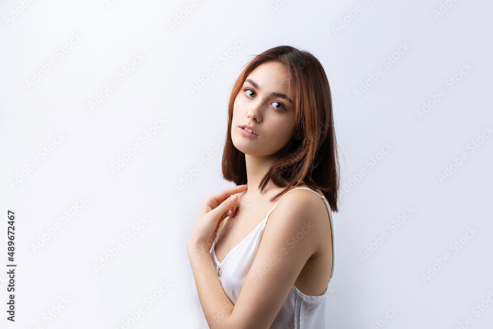 Beautiful smiling woman with clean skin, natural make-up and white teeth on a gray background Beautiful smiling woman with clean skin, natural make-up and white teeth on a gray background