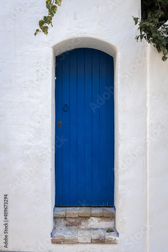 Beautiful blue door and white wall in Sitges, Spain.