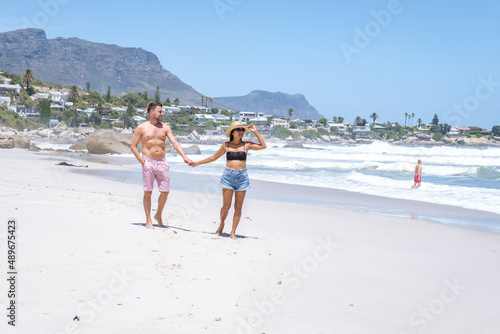 Clifton beach Cape Town South Africa, white sandy beach in Cape Town Clifton. Couple man and woman on the beach photo