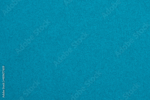Turquoise blue background with paper fabric canvas texture for layout, collage, coaster. Pure color.