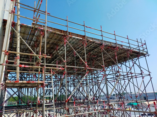 scaffolding with sky background. Concept for the construction of industrial plants. scaffolding used in construction © niwat