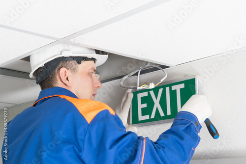 the master in uniform, for the maintenance of emergency evacuation exits, repairs the warning system, hangs the exit sign