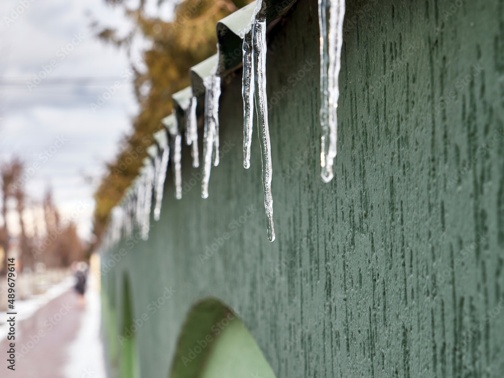 Heated icicles melt and drip water. Heated icicles melt and drip water.