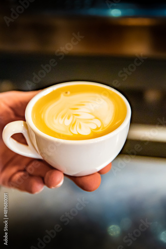Barista hand making cappuccino Coffee with espresso and milk in cafe