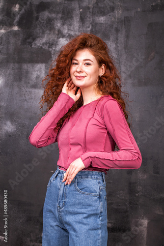 Portrait of a young beautiful red hair girl