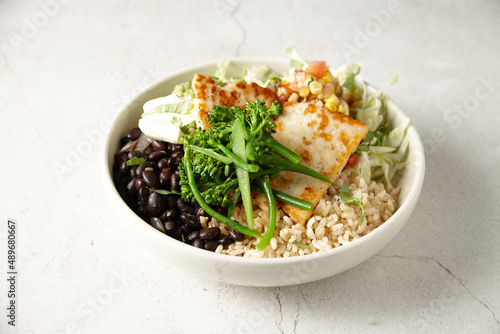 Halloumi dish with brocolini, beans and brown rice photo