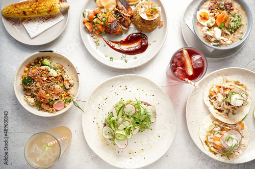 Overhead of various appetising dishes on table photo