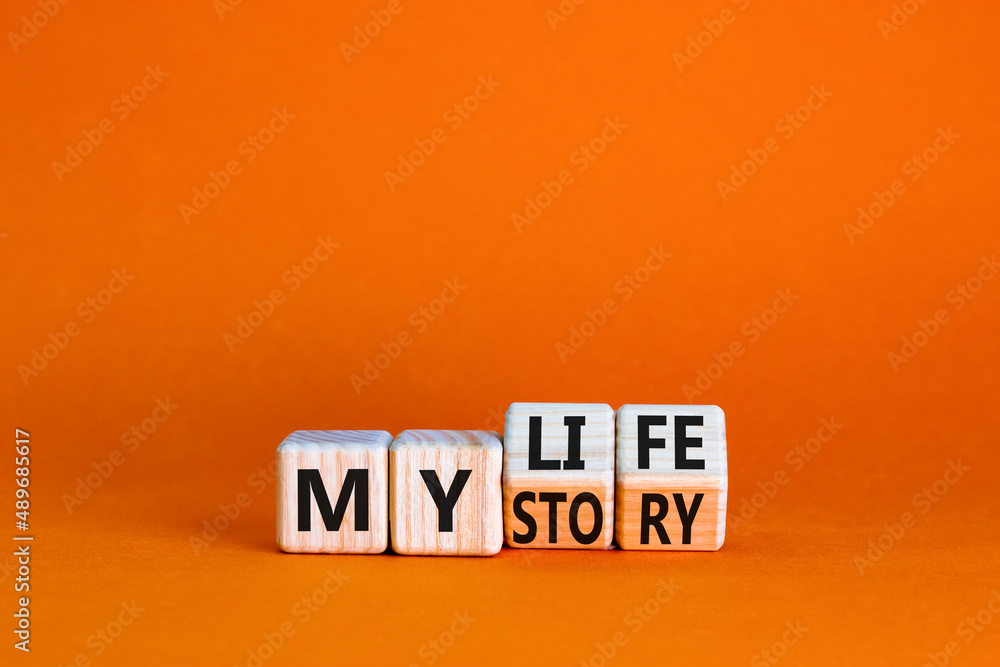 Story of my life symbol. Turned wooden cubes and changed concept words My story to My life. Beautiful orange table orange background. Business story of my life concept. Copy space. - obrazy, fototapety, plakaty 