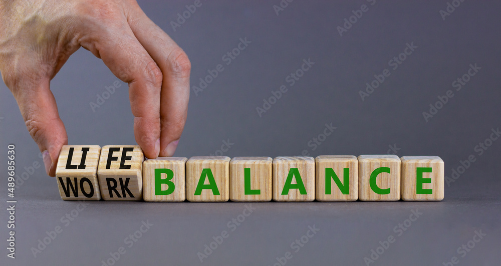 Work life balance symbol. Businessman turns cubes and changes concept ...