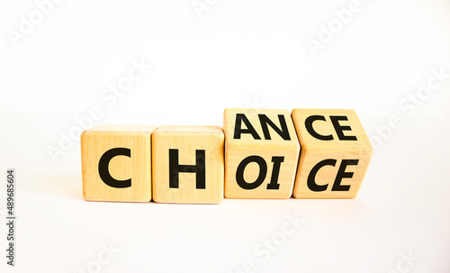 Choice and chance symbol. Turned wooden cubes and changed the concept word Choice to Chance. Beautiful white table white background, copy space. Business choice and chance concept.