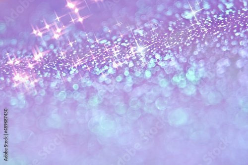 紫色の光のキラキラ背景