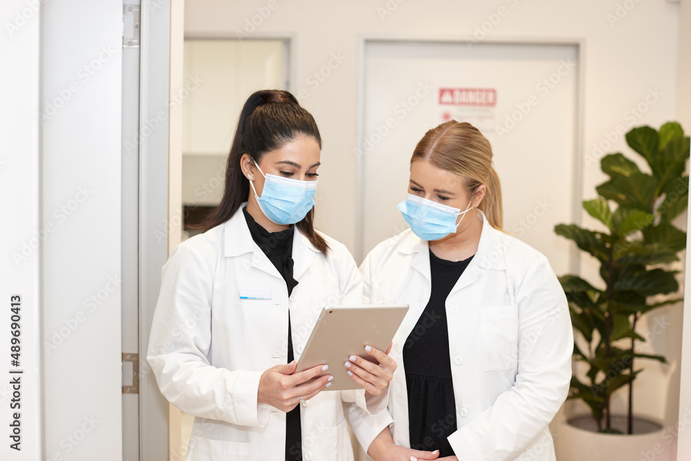 Medical practitioners working together at their practice Medical practitioners working together at their practice