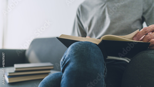 Man working or studying with book . Business and education concept
