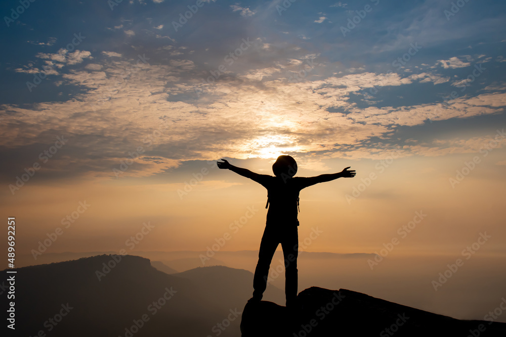 silhouette of person with arms outstretched silhouette of person with arms outstretched