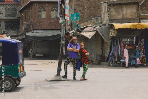 White Tourists Man and Woman posing in the Peshawar City Center, Pakistan