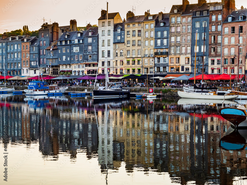 Picturesque view of Honfleur waterfront, famous village harbor in Normandy, France
