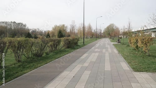 An alley in the park with a view of the Moscow metro