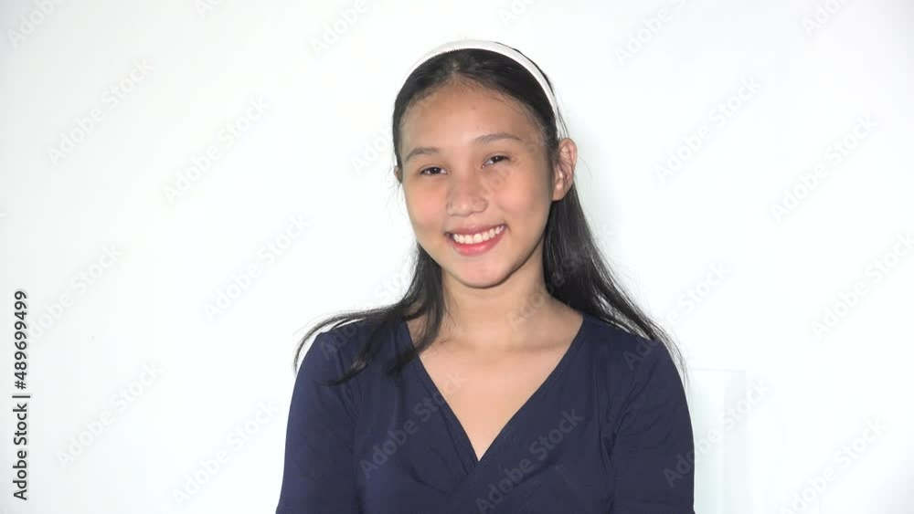 A Happy Filipina Teen Girl Wondering A Happy Filipina Teen Girl Wondering