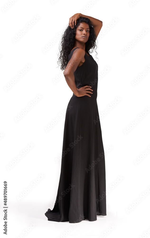 Dark beauty. A beautiful ethnic woman standing in a long black dress.