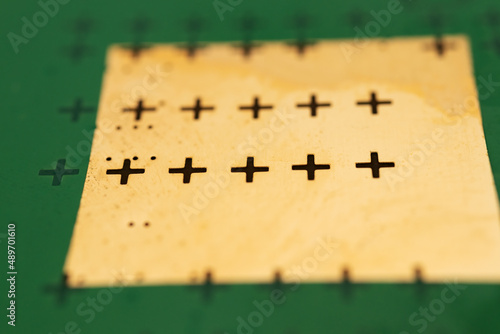 Cruciform markups on a smartphone printed circuit board photo