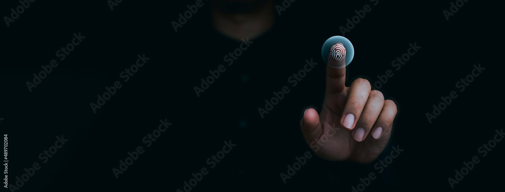 Blue fingerprint scan icon on virtual screen while finger scanning for security access with biometrics identification on dark. Cyber security, privacy data protection technology for business. - obrazy, fototapety, plakaty 