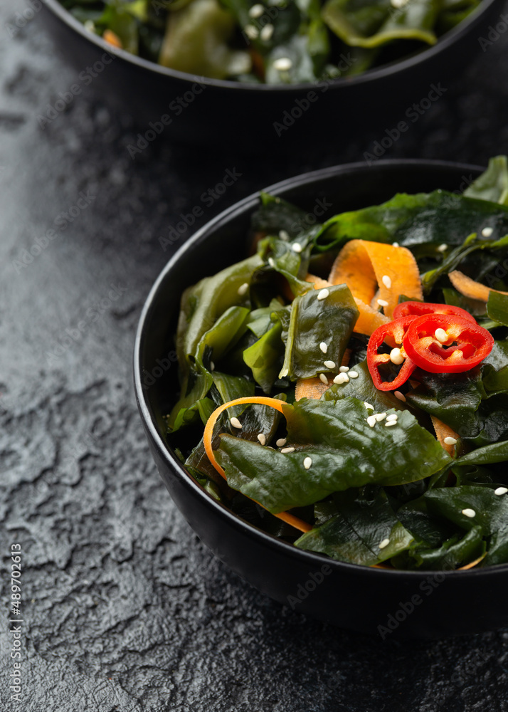 Wakame Seaweed salad with carrots, sesame seeds and sauce. Healthy food. Wakame Seaweed salad with carrots, sesame seeds and sauce. Healthy food.