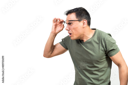 Obraz na plátne Man adjusting glasses and looking at distance