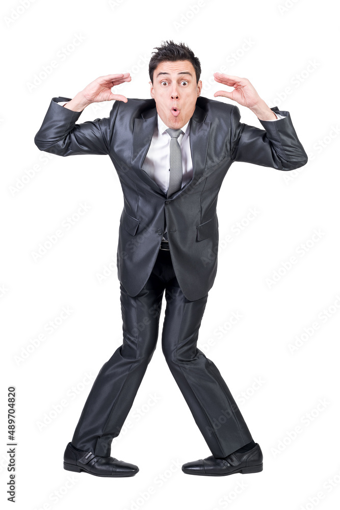 Mad young guy gesturing and making funny grimace in studio Mad young guy gesturing and making funny grimace in studio